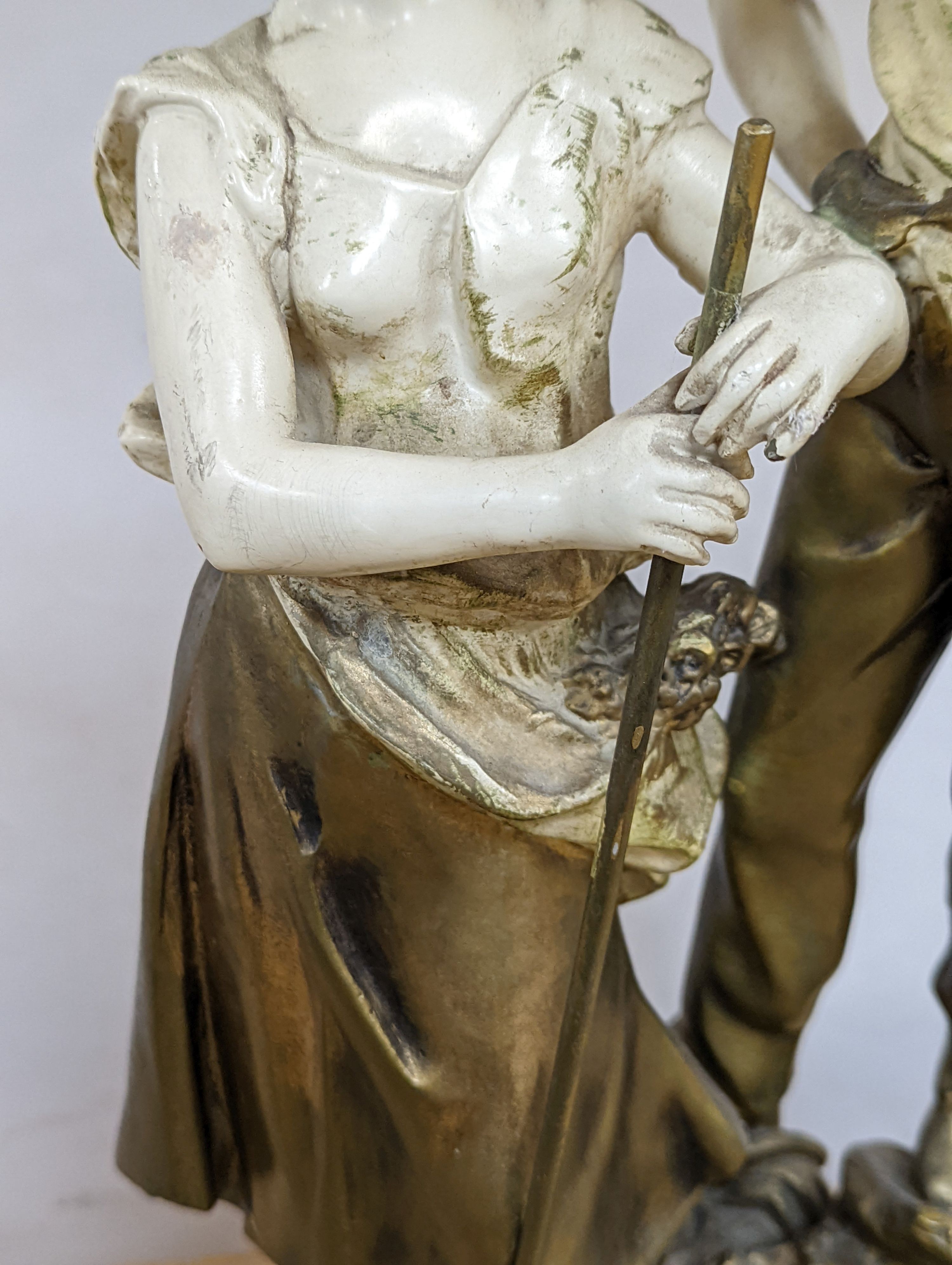 After L & F Moreau - a painted spelter figural table lamp, peasant girl and boy, 96 cms high including shade.